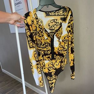 Gold and black snap closure bodysuit